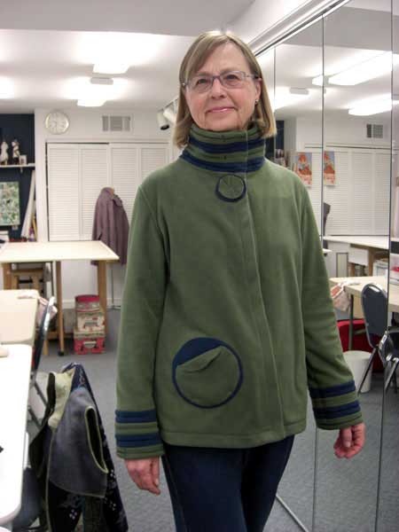 Barbara sews a jacket in the sewing workshop