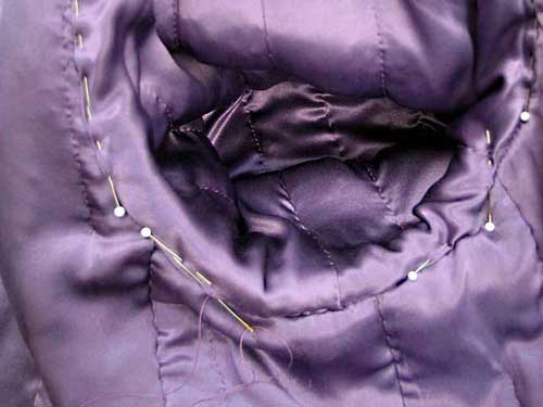 Stitching sleeve lining to body lining