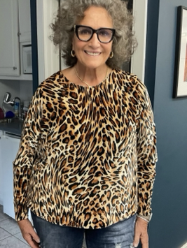 Lisa wearing her animal print stretch velour top