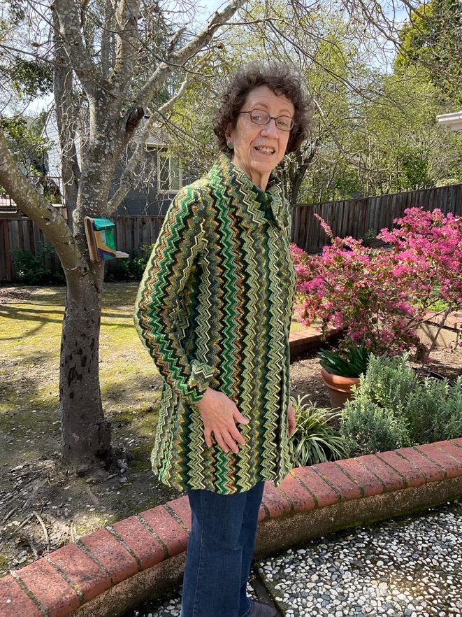 Zelda Bronstein wearing her shirt and green pants